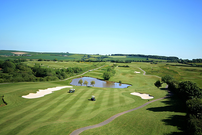 A view over the 15th Hole of the golf course with a stunning background